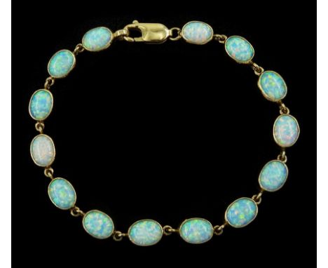 9ct gold opal bracelet, oval opals bezel set as individual links, hallmarkedCondition Report:Approx 12.1gm, overall length = 