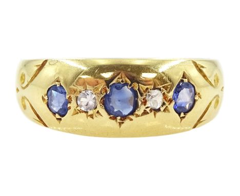 18ct gold sapphire ring, three graduated cushion cut sapphires spaced by an old cut diamond and white spinel, hallmarked Birm