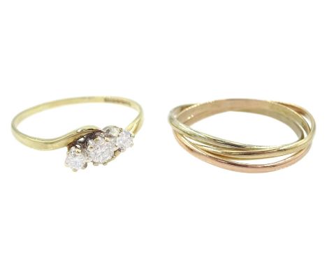9ct gold three stone round brilliant cut diamond crossover ring, hallmarked, total diamond weight approx 0.20 carat, and a 9c