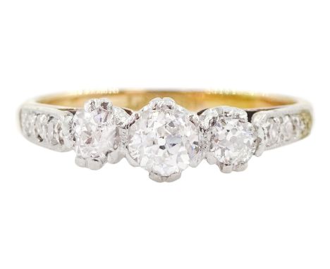 Gold three stone old cut diamond ring, graduated diamonds to diamond set shoulders, stamped 18CT&PT, total diamond weight app