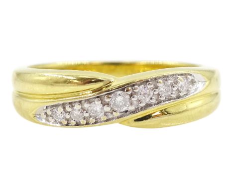 18ct gold diamond band ring, scroll of seven round brilliant cut diamonds between plain gold bands, hallmarkedCondition Repor
