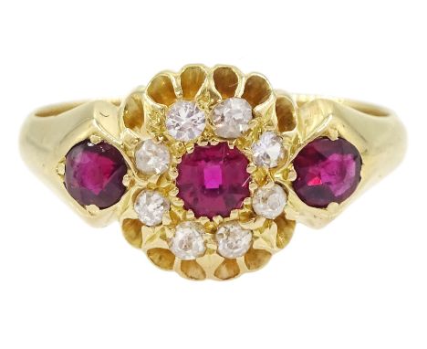 18ct gold ruby and diamond cluster ring, three graduated cushion cut rubies within a border of old cut diamonds, to a taperin