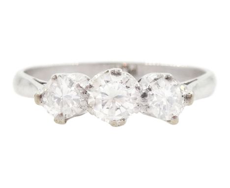 Platinum three stone round brilliant cut diamond ring, stamped Plat, total diamond weight approx 0.70 caratCondition Report:A