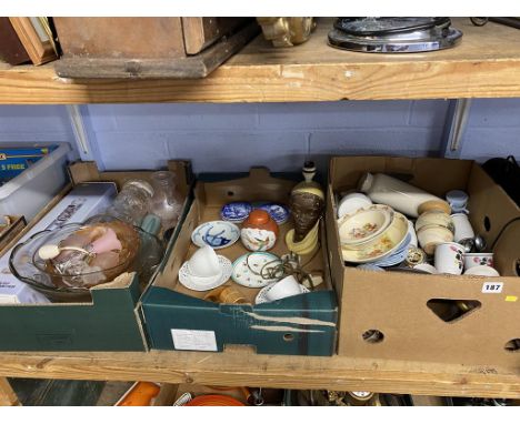 A shelf of assorted, to include a 1950s lamp etc.