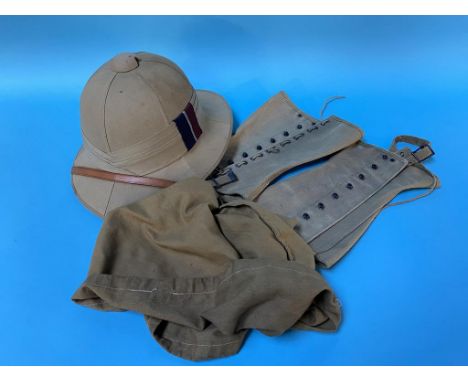 A J. Compton and Webb Limited of London pith helmet, bag and pair of garters