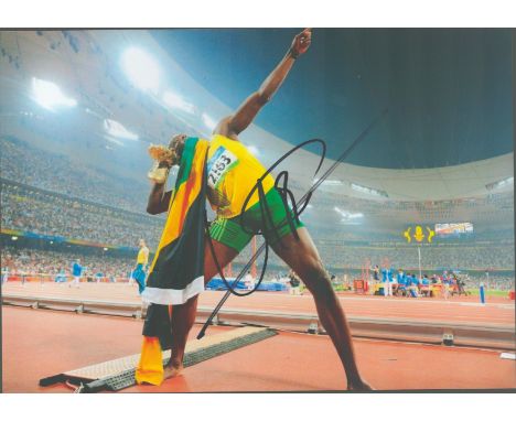 Usain Bolt signed 12x8 colour photo. Bolt, OJ, CD, OLY is a retired Jamaican sprinter, widely considered to be the greatest s