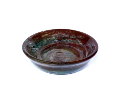 Art Glass Large shallow glass bowl, circa 1960 of mottled red and green colour 33cm diameter
