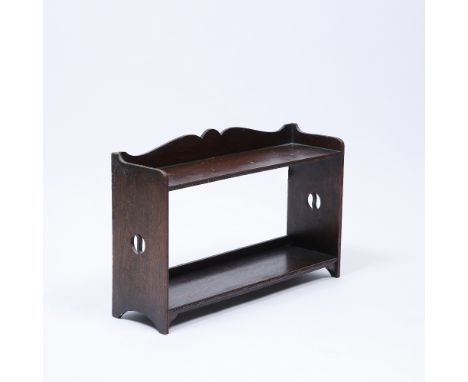 Manner of Liberty & Co. Oak hanging wall shelf with pierced motif to side and beaded border to front 38cm high, 61cm wide. Pr