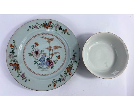 An 18th century Chinese polychrome decorated floral plate, d. 23cm and a later Chinese bowl decorated with flowers, seal mark