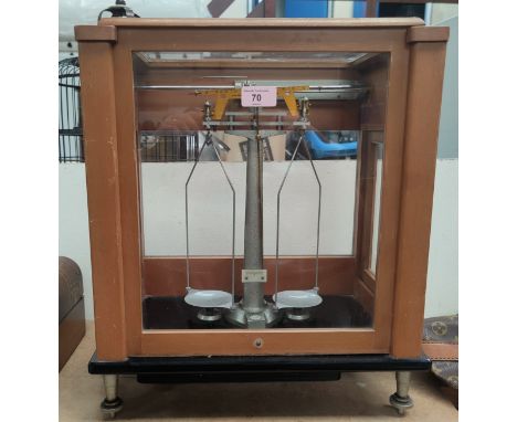 A set of laboratory balance scales by Stanton Instruments, in glass case 