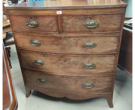 A George III mahogany bow front chest of 3 long and 2 short drawers with oval drop handles, on splay bracket feet 