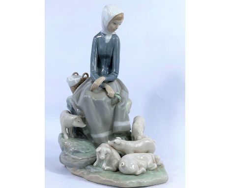 A Lladro group:  seated girl and pigs, height 28 cm 