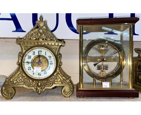 An Edwardian mantel clock in ornate brass case; a desk top barometer a modern  'Hugo Metobar' barometer 