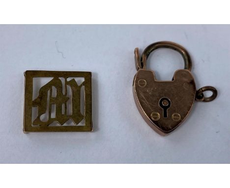 A 9 carat hallmarked gold heart lock; a yellow metal pierced 'M' link, stamped '9ct', 3.9 gm 