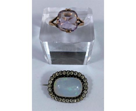 A 19th century opal brooch in paste setting, opal 18 x 12 mm; a 9 carat gold ring 