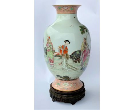 A Chinese baluster vase with a flared rim and scenery depicting a young warrior courting, with red and gilt highlights, seal 