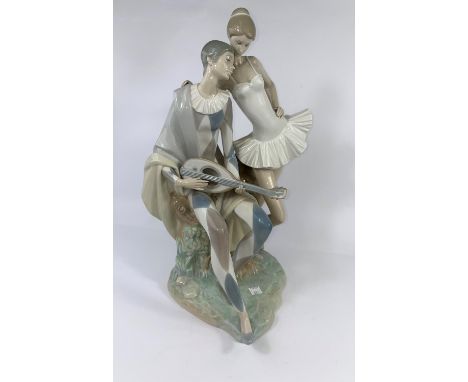 A large Lladro group: harlequin with mandolin and ballet dancer, height 47 cm.  Condition report for lot 433In good condition