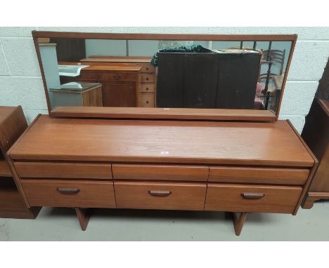 A mid century teak dressing table by William Lawrence with 6 drawers beneath and long mirror H120 x D44 x L156cm 