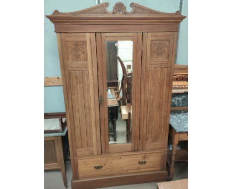 A stripped wood single drawer, mirror door wardrobe, with single drawer to base. 