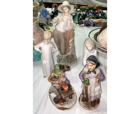 A Lladro figure of a Shepherd feeding a lamb &amp; two other Lladro figures etc. 