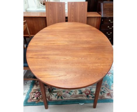 A 1960's dining suite comprising G-Plan teak extending table with 2 leaves, extended length 260 cm, and a set of 8 chairs by 