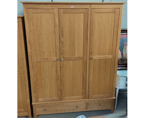 A modern light oak triple wardrobe by Corndell Nimbus 