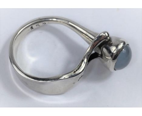 A George Jensen silver ring designed by V Torun  Bülow-Hübe, with oval moonstone in raised 'Y' setting, stamped marks, size M