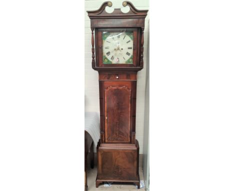 An early 19th century longcase clock in crossbanded figured mahogany with swan neck pediment and turned columns to the hood, 