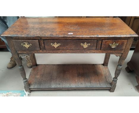 An oak 18th century style side table with three drawers  and an under shelf H81 x L116 x D 48cm 