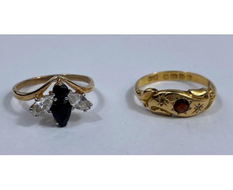 An 18 carat hallmarked gold Victorian style dress ring set garnet, 2 gm;  a 9 carat hallmarked gold gem set dress ring in the