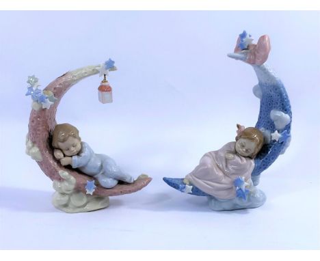Two Lladro porcelain groups - babies sleeping on crescent moons, 1 boy &amp; 1 girl.  No/6583, 6479, height 20cm. 