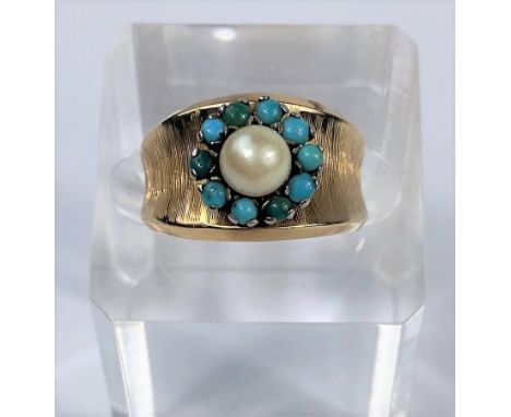 A yellow metal dress ring set central pearl surrounded by turquoise, stamped '18', 5.1 gm 