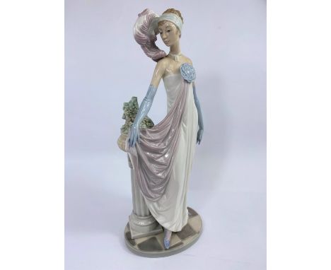 A Lladro figure in 1920's dress, height 35 cm 