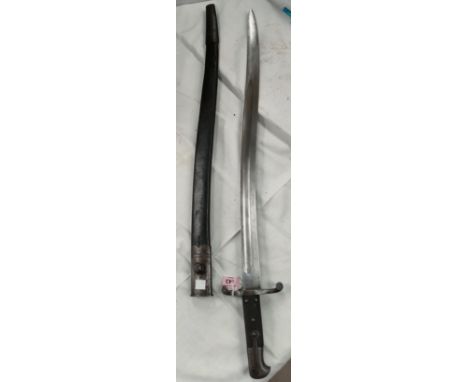 A BRITISH 1860 pattern Yataghan sword bayonet with leather scabbard, the blade stamped WD 13 crown (blade 58cm) 