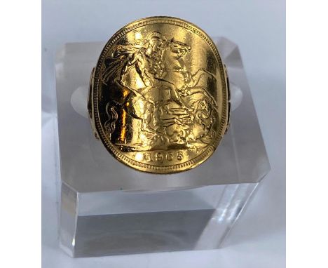 A ring formed and shaped from a 1965 sovereign, shank unmarked, 9.5 gm gross weight in good condition, no damage, not excessi