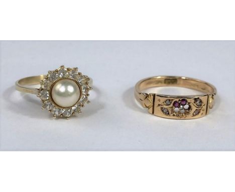 A yellow metal dress ring set central pearl surrounded by clear stones, stamped '585'; a Victorian style dress ring, gm set, 