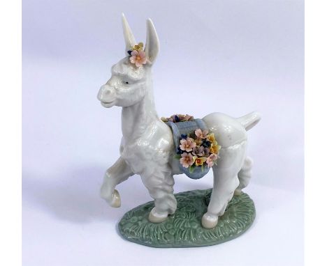 A Lladro figure of a Donkey draped in flowers No/6573 height 17cm. 