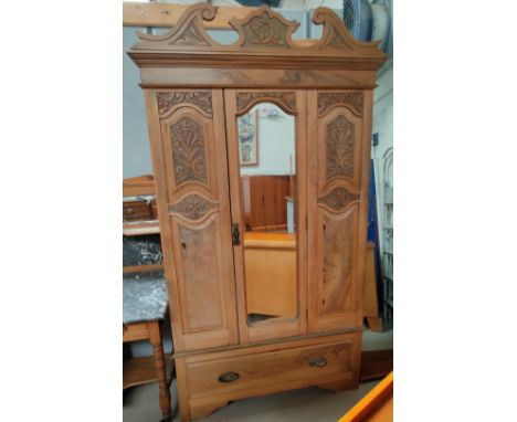 A stripped walnut single mirror door wardrobe, with single drawer to base. 