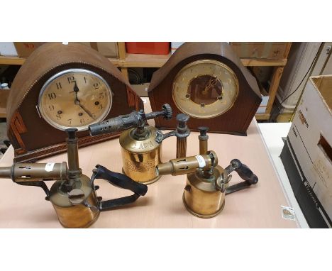 A Max Sievert, Stockholm brass blow lamp, two other lamps and two mantle clocks. 