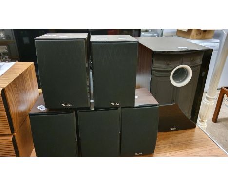A Onkyo AV receiver model TX-SR 605 with handset together with a Teufel Theatre 80 5.1 surround sound speaker system, both ma