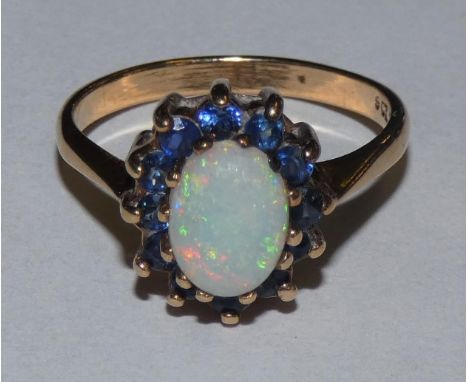 A 9ct gold opal and sapphire cluster ring, 2.5gms, size L1/2 