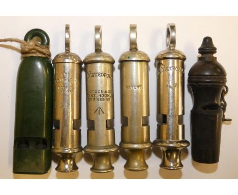 A Hudson Metropolitan whistle, with broad arrow stamp, another Metropolitan whistle and other other whistles (6) 