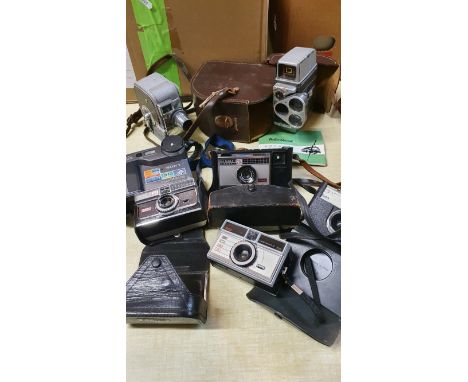 3 boxes of camera's and accessories to include, a Bell &amp; Howell Autoset turret camera, a Keystone 25 Capri camera, camcor