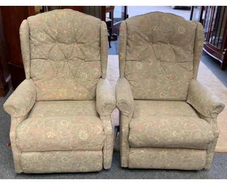 A pair of manual reclining armchairs. 