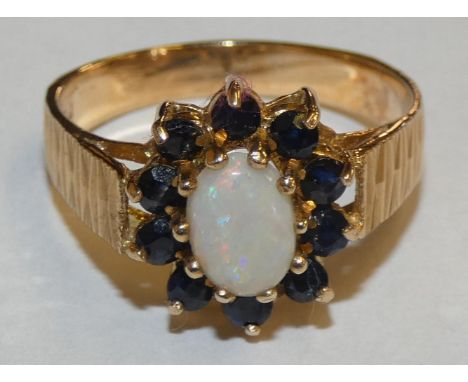 A 9ct gold opal and sapphire cluster ring, 2.7gms, size O 