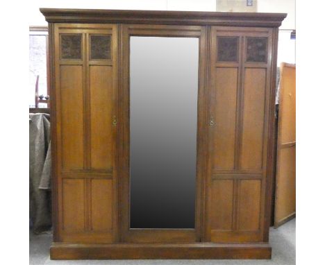 A mahogany triple wardrobe with central mirrored door (pin attachment), the left side 'double' provides full width top shelf 