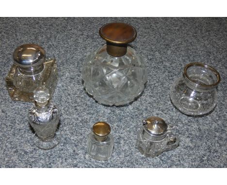 A silver mounted inkwell, Birmingham 1911, with hob nail cut base, a silver mounted glass mustard pot, Chester 1913, three ot