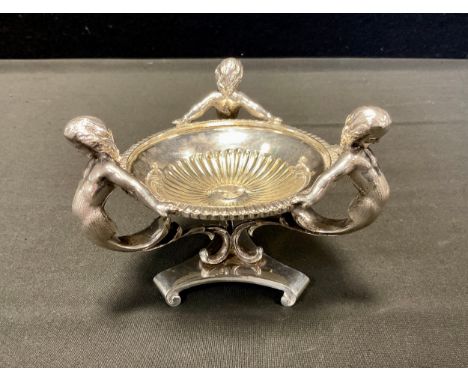 A 19th century silver plated tripod bon bon dish by Thomas Prime and sons, fluted bowl supported by three cast mermaids, scro