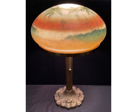 A mid century, Pittsburgh Lamp Co. Style table lamp, the domed glass shade hand-painted with Palm trees, on a brass base, 46c