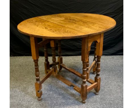 A oak double drop leaf gate leg table, 20th century. 75cm high x 83cm wide x 100cm deep 